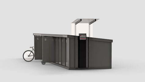 Neumaier rental station for e-bikes and e-scooters with integrated charging statioon and payment option.